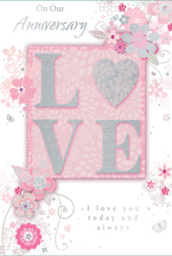 An open anniversary card is seen in close detail, its artwork evoking the gentle romance of a quiet evening stroll along Fulham's leafy streets. At the centre, the eye is drawn to the word LOVE, printed in large capitals that stand slightly proud from the card's surface. Each letter is edged with frosted glitter in tones of blush pink and shimmering silver, creating a subtly sparkling texture that hints at both celebration and tenderness. This word rests on a soft blush-pink rectangle, giving it a sense of structure, as though framed within the card. Around this focal point, delicate, stylised flowers and flowing foliage drift across the card in curved sweeps. The blooms, reminiscent of roses and cottage-garden flowers, are rendered in fine linework and gentle shading, with petals in pale pink, white, and soft grey. Tiny silver accents highlight individual leaves and petal edges, recalling the quiet glimmer of streetlights reflecting off the Thames near Chelsea Harbour. The background remains a hushed pastel pink, creating a calm, romantic field in which the flowers appear to float. Between the floral trails, elegant script lettering delivers heartfelt anniversary wishes, including phrases such as I love you today and always, written in a graceful hand that feels both refined and deeply personal. The entire card has the feeling of a floral sketch come to life, as if a Fulham florist had translated the curves of a hand-tied bouquet into paper form. It is the kind of card that would sit beautifully beside an anniversary arrangement delivered to homes around Parsons Green, Hammersmith, or the quiet streets that branch from King's Road.
